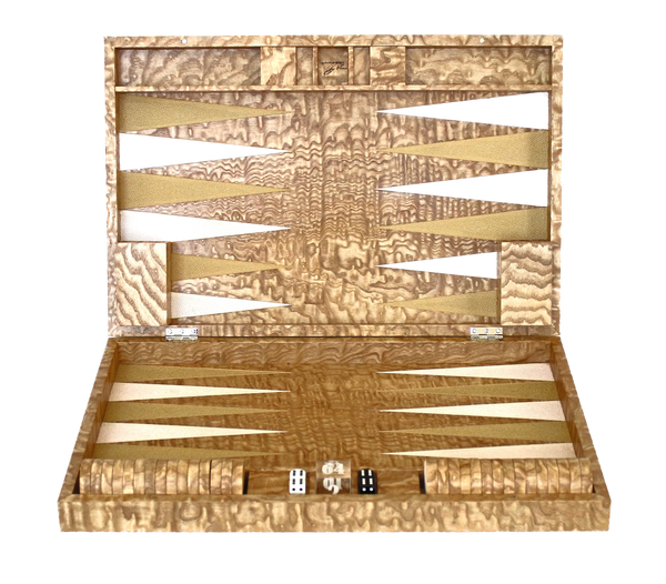 Wooden backgammon set with pieces and dice on a white background
